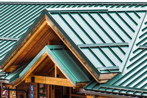 a house with a metal roof at an angel|metal shingle roof cost.